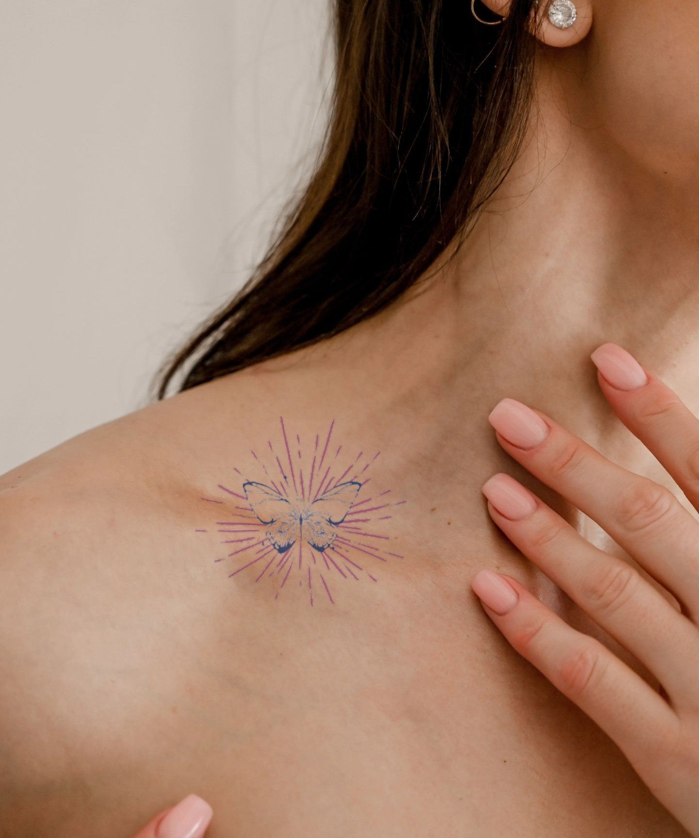 Pink Starburst Mandala hand-drawn temporary tattoo — celestial design, suited for collarbone placement. Waterproof, plant-based, 3–7 day wear. By LastingDays indie artist collective.