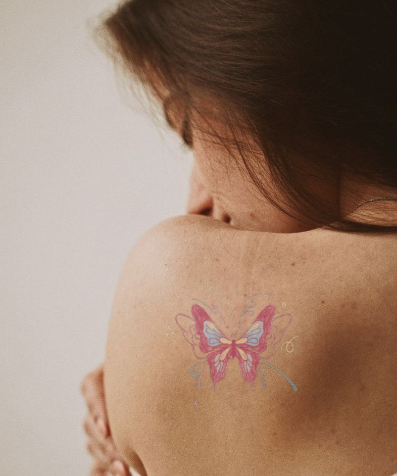 Bold Red Butterfly hand-drawn temporary tattoo — wing motif, suited for shoulder placement. Waterproof, plant-based, 3–7 day wear. By LastingDays indie artist collective.