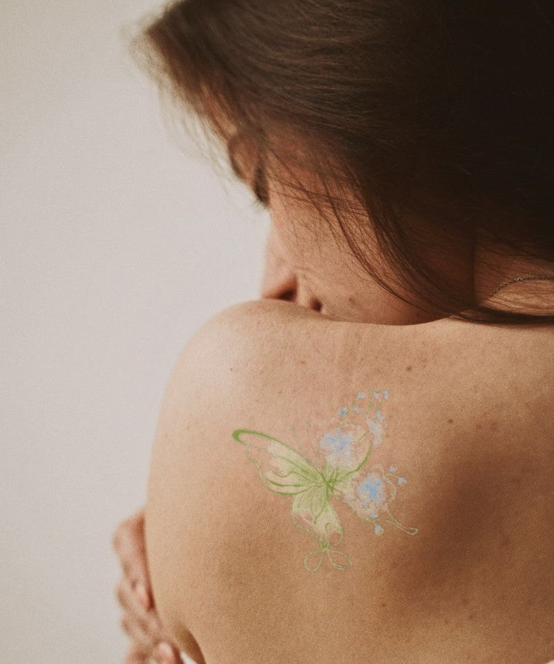 Green Garden Butterfly hand-drawn temporary tattoo — wing motif, suited for shoulder placement. Waterproof, plant-based, 3–7 day wear. By LastingDays indie artist collective.