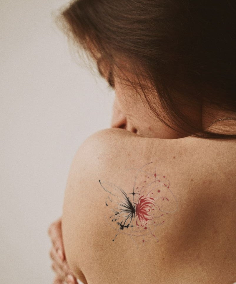 Ink Wash Butterfly hand-drawn temporary tattoo — wing motif, suited for shoulder placement. Waterproof, plant-based, 3–7 day wear. By LastingDays indie artist collective.