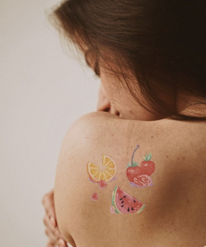 Tropical Fruit Basket hand-drawn temporary tattoo — hand-drawn original design, suited for forearm placement. Waterproof, plant-based, 3–7 day wear. By LastingDays indie artist collective.