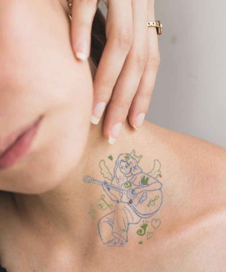 Music Girl with Guitar hand-drawn temporary tattoo — anime illustration style, suited for forearm placement. Waterproof, plant-based, 3–7 day wear. By LastingDays indie artist collective.