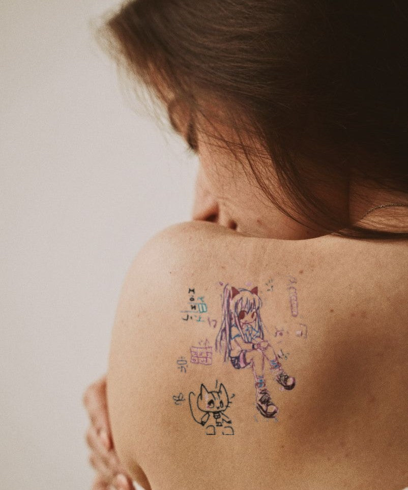 Cat & Gift Chibi hand-drawn temporary tattoo — animal subject, suited for forearm placement. Waterproof, plant-based, 3–7 day wear. By LastingDays indie artist collective.