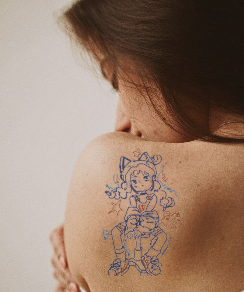 Adventure Hero Character hand-drawn temporary tattoo — anime illustration style, suited for forearm placement. Waterproof, plant-based, 3–7 day wear. By LastingDays indie artist collective.
