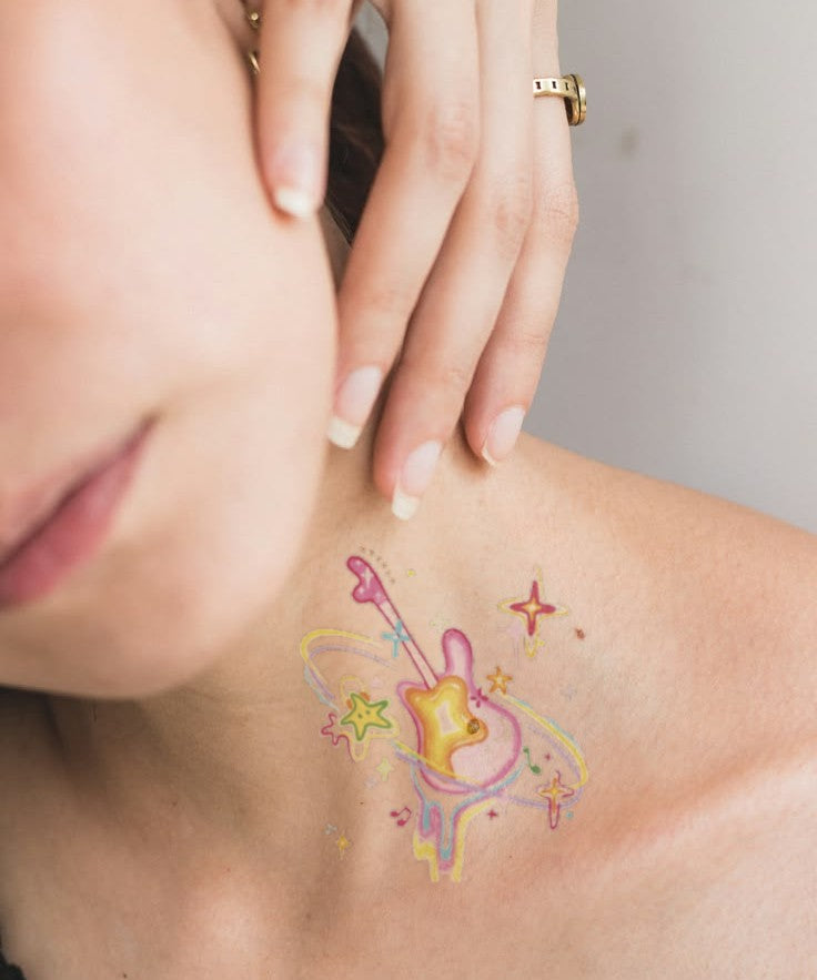Kawaii Music Stars hand-drawn temporary tattoo — celestial design, suited for collarbone placement. Waterproof, plant-based, 3–7 day wear. By LastingDays indie artist collective.