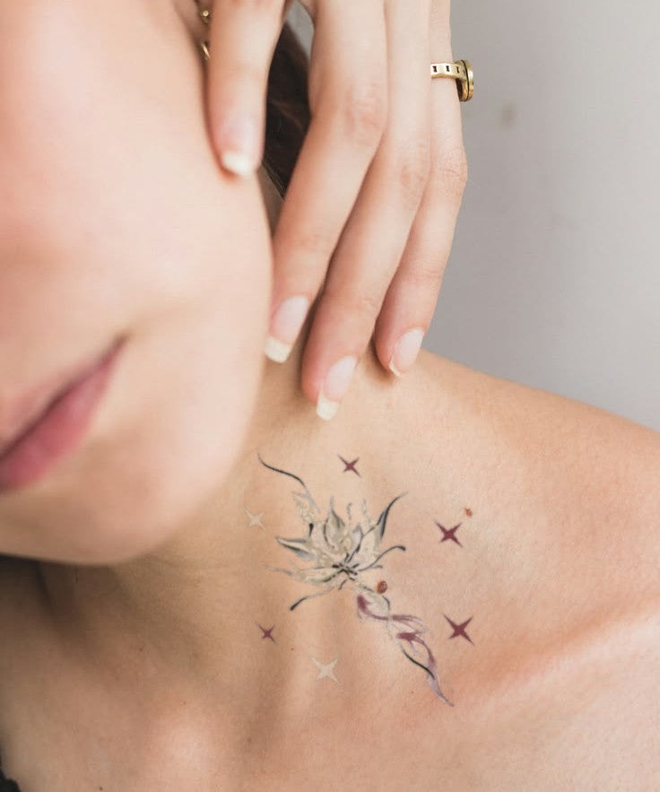 Minimal Star Branch hand-drawn temporary tattoo — botanical line work, suited for collarbone placement. Waterproof, plant-based, 3–7 day wear. By LastingDays indie artist collective.