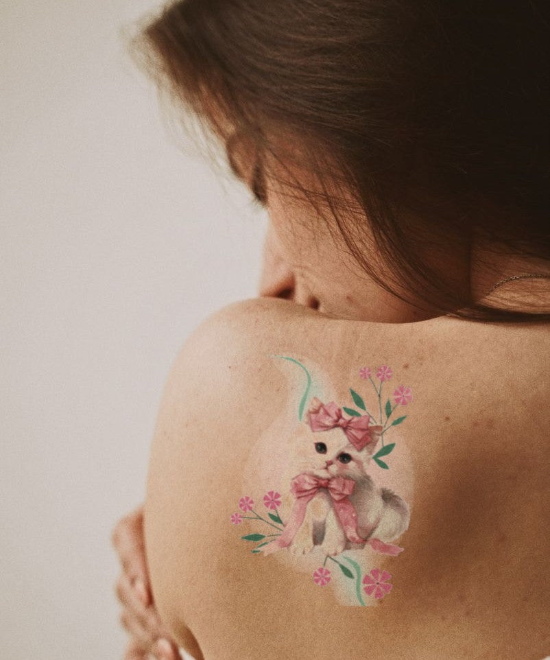 Cherry Blossom Kitten hand-drawn temporary tattoo — botanical line work, suited for forearm placement. Waterproof, plant-based, 3–7 day wear. By LastingDays indie artist collective.