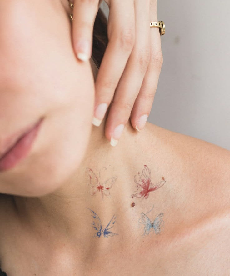 Floating Blue Butterflies hand-drawn temporary tattoo — wing motif, suited for forearm placement. Waterproof, plant-based, 3–7 day wear. By LastingDays indie artist collective.