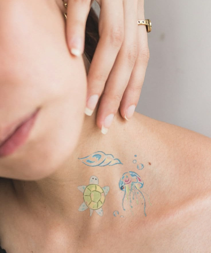 Sea Turtle & Jellyfish hand-drawn temporary tattoo — marine illustration, suited for forearm placement. Waterproof, plant-based, 3–7 day wear. By LastingDays indie artist collective.
