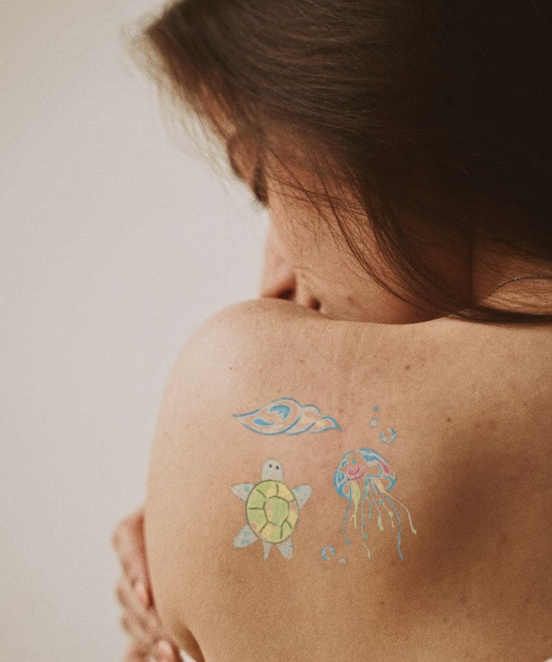 Sea Turtle & Jellyfish hand-drawn temporary tattoo — marine illustration, suited for forearm placement. Waterproof, plant-based, 3–7 day wear. By LastingDays indie artist collective.
