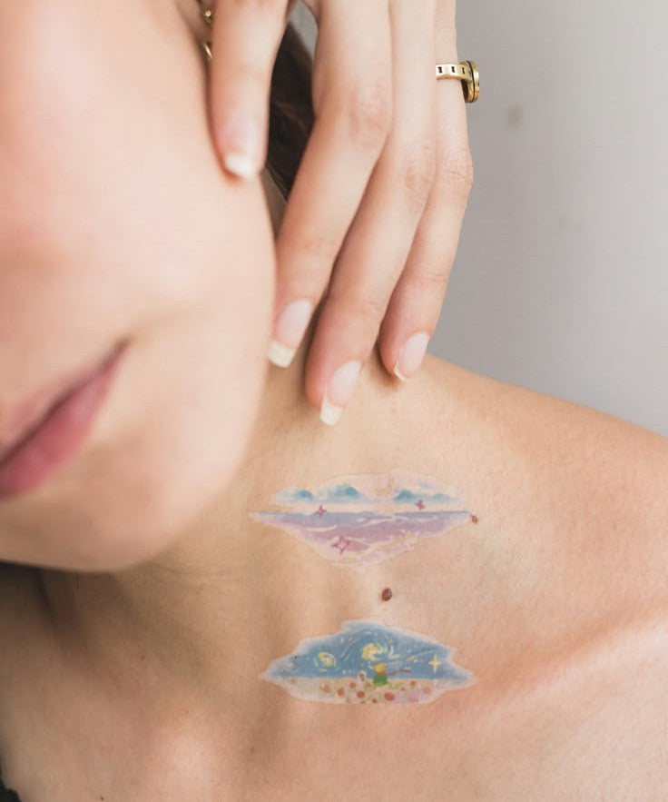 Dreamy Cloudscape hand-drawn temporary tattoo — marine illustration, suited for forearm placement. Waterproof, plant-based, 3–7 day wear. By LastingDays indie artist collective.