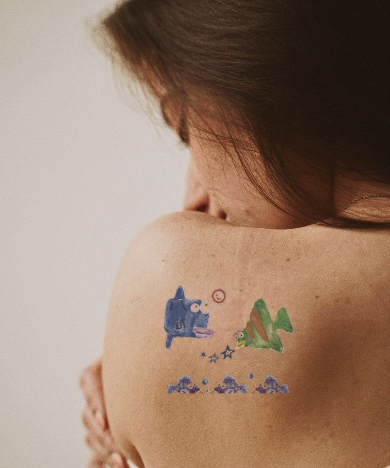 Whale & Mountain Dream hand-drawn temporary tattoo — marine illustration, suited for forearm placement. Waterproof, plant-based, 3–7 day wear. By LastingDays indie artist collective.