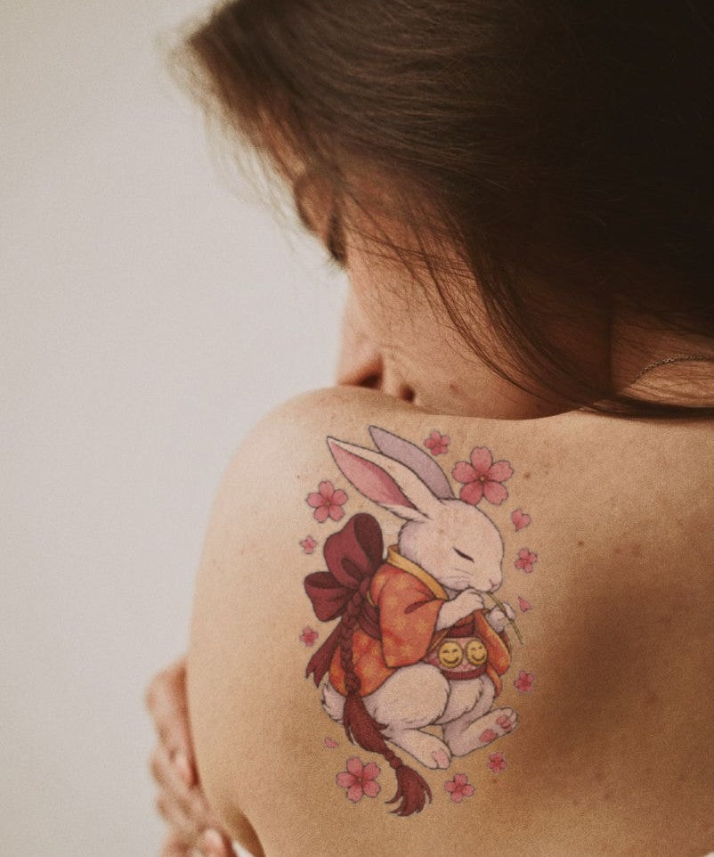 Sakura Moon Rabbit hand-drawn temporary tattoo — botanical line work, suited for forearm placement. Waterproof, plant-based, 3–7 day wear. By LastingDays indie artist collective.